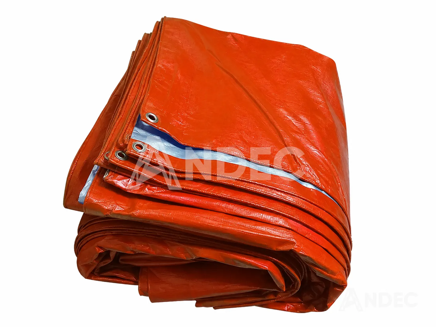Manta de tarflex ligera naranja plegada, con ojales metálicos en el borde